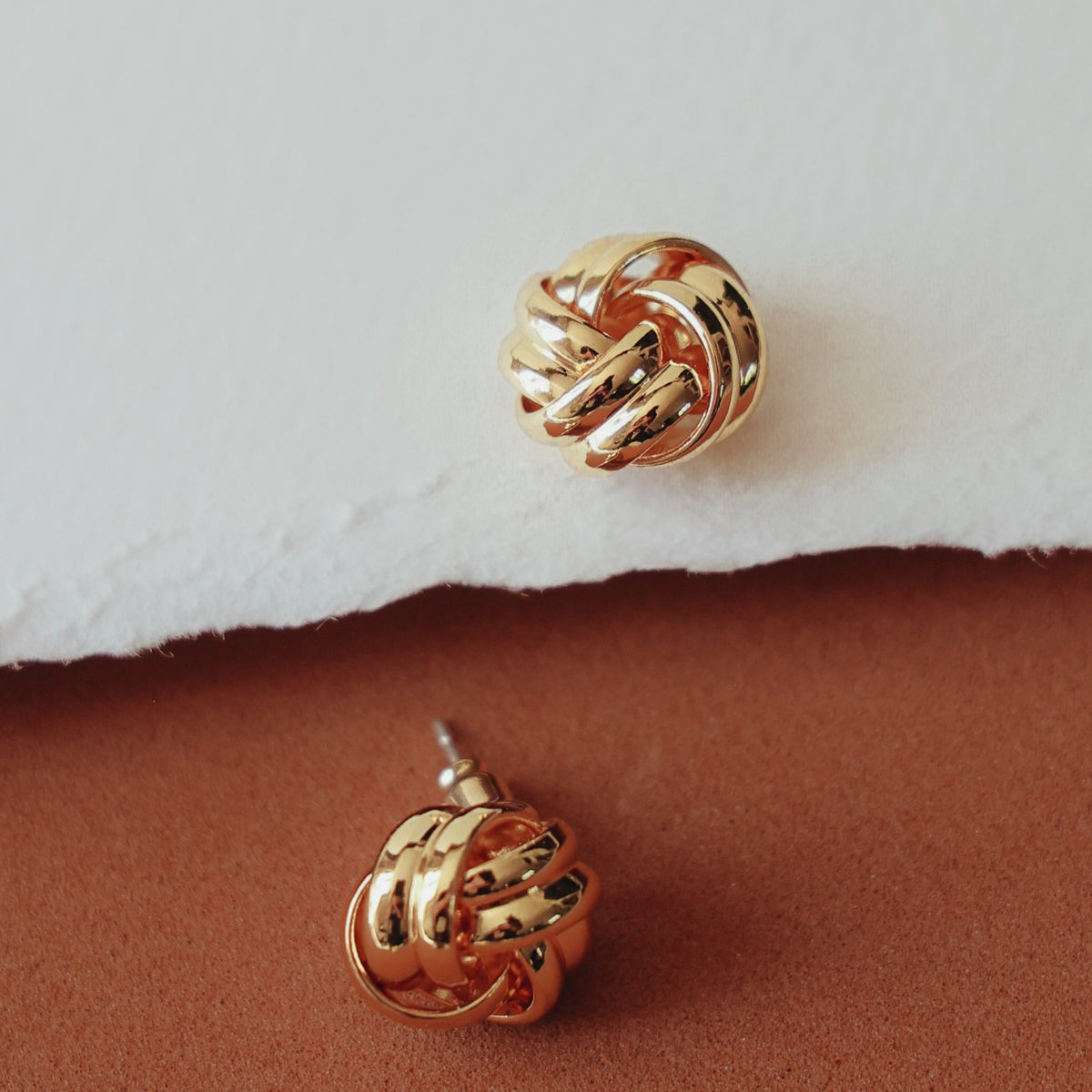 Beatrice knot studs from the front and from the side, showing the post